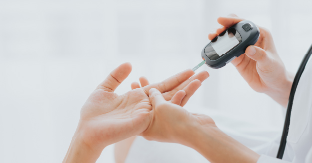 Doctor doing a blood sugar test